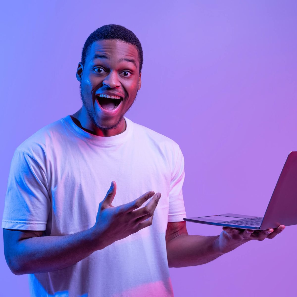 cool-website-excited-black-man-with-laptop-in-han-2022-10-07-02-01-30-utc